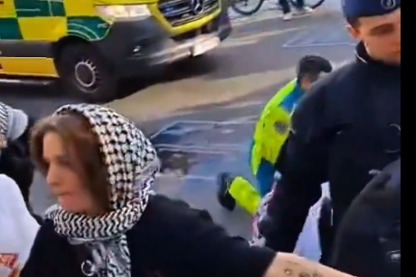 “Emergency responders and Belgian police secure the scene after a stabbing at a pro-Gaza protest in Brussels.”