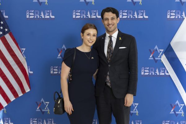 Sarah Milgrom and Yaron Lischinsky standing at the Israeli embassy in Washington DC